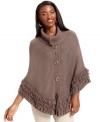 Ponchos are one of this season's hottest style trends! Style&co.'s comfy knit design features a warm funnel-neck and a fun fringe hem.