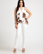 Bedecked by stunning white beads this relaxed-fit, sleeveless top is the embodiment of effortless style. Whether paired with skinny jeans or your favorite skirt, this design is guaranteed to be a welcomed addition to your wardrobe.Embroidered v-necklineSleevelessAbout 28 from shoulder to hemViscoseDry cleanMade in USA