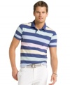 Show your softer side. Get classic bold style with subtle pastel stripes in this polo shirt from Izod.