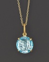 Sky blue topaz sparkles in a 18K yellow gold setting.