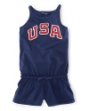 A red, white and blue design with U.S.A. patching gives a preppy, all-American look to a pretty warm-weather romper in celebration of Team USA's participation in the 2012 Olympics.