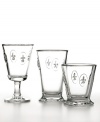 An ode to France, Fleur de Lis wine goblets are embossed with the country's unofficial yet enduring symbol. Masculine and sophisticated with a stocky base and flared bowl, this set is designed to last in heavy, famously durable glass.