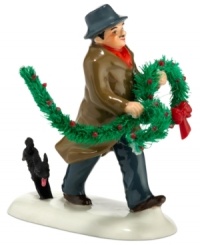 Bringing home the holly, this dapper fellow is trailed by a family dog who can't contain his excitement. A humorous figurine from Snow Village, by Department 56.