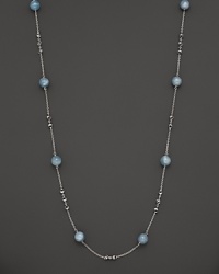 This sterling silver necklace, gleaming with aquamarine, makes an elegant statement. By Di MODOLO.