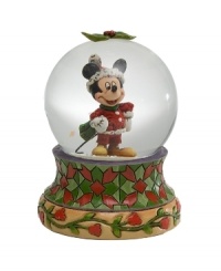 Jim Shore brings his unique folk art-inspired artistry to a beloved American icon in celebration of the holiday season. Holiday Mickey snow globe is sure to charm everyone on your list.