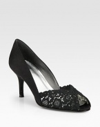 Exquisite chantilly lace is highlighted by tonal Swarovski crystal detail in a classic peep-toe design. Self-covered heel, 2½ (65mm)Chantilly lace upperSwarovski crystal detailLeather lining and solePadded insoleImported