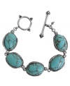 Breezy, bohemian style. Lucky Brand's chic toggle bracelet includes semi-precious turquoise stones set in antiqued silver tone mixed metal. Approximate length: 7-5/8 inches.