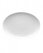 With subtle concentric rings and a sleek shape in durable porcelain, Rosenthal's Loft oval platter brings chic versatility to modern tables.