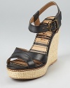 A summery, woven wedge is toughened up by edgy black leather on these Splendid wedges, a transitional style that seamlessly moves from uptown to downton.