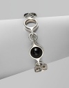 An unique and modern design featuring black agate spherical inset links and sterling silver circular links. Black agateSterling silverToggle closureLength, about 7½Imported 