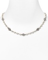 This charming necklace from Lauren Ralph Lauren features crystal stones and glass pearls.