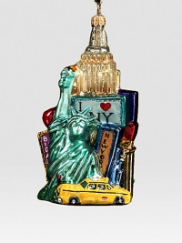 New York City is aglow with lights as the sun sets on this artful glass ornament. About 5 1/2H 4W Made in Poland