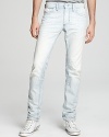 Slim fit jeans in faded railroad stripes with light distressing.