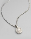 From the Petite Albion Collection. Sterling silver necklace has round pendant with pavé diamonds. Diamond accents, .54 tcw Lobster claw clasp 17 long Imported