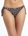 THE LOOKAllover leopard printSide tiesElastic waist and leg openingsTHE MATERIAL80% nylon/20% spandexFully linedCARE & ORIGINHand washMade in USAPlease note: Bikini top sold separately. 