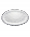 Pretty and polished, this Organics oval tray from Lenox's collection of serveware and serving dishes combines a natural shape in bright aluminum with a delicately beaded edge.