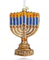 Light the candle and trim the tree. The glass menorah ornament from Kurt Adler brings festive new flair to any and every celebration.