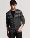 Burberry riffs on its signature look, putting a modern spin on this handsome cardigan with an oversized check print in a soft wool blend.