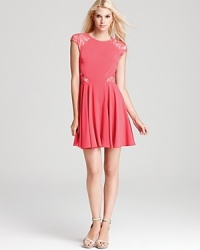 In a vibrant, rosy hue, this ERIN Erin Fetherston dress gets cheeky with lace cutouts.