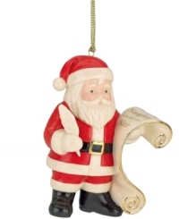 Secure a spot on Santa's Nice list with this whimsical ornament celebrating Father Christmas himself. Polished gold accents add a festive touch to the classically styled Lenox collectible.