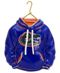 Fitting for Florida alum, this hand-painted hoodie ornament trims the tree in Gators orange and blue. Glitter amps up the school and holiday spirit.