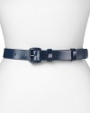 Perfect proportions with a slick patent sheen. This leather skinny belt from WCM effortlessly defines your waistline.