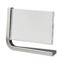 Movie horizontal frames by Nambé. Designed by Neil Cohen for Nambé, these sleek metal frames feature a metal base and two squares of glass to protect your pictures. The movie frame is a wonderful gift for the home or office.