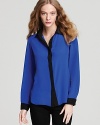 A royal welcome to fall, this dual-color Amanda Uprichard blouse brightens your day...and your wardrobe.