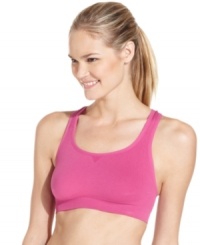 Energize your workout routine in Ideology's bright pink sports bra. Crisscross straps at the back lend comfort and support.