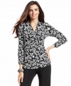 This printed top from Alfani is perfect with a pair of chic black pants for Monday through Friday. (Clearance)