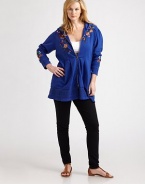 Featuring embroidery, this hoodie would be a stylish addition to any wardrobe. The peplum waist is ultra-feminine and flattering.Attached hoodLong sleevesFront zipperAbout 32 from shoulder to hemCottonMachine washImported