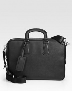 Protect your investment with this stylish computer case rendered in textured saffiano leather.Zip closureDouble top handlesAdjustable shoulder strapInterior pockets15¾W x 12H x 11DMade in Italy