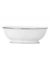 Refine your formal table with classic cream and white. Trimmed in platinum and accented with a raised dot and scroll pattern, this Opal Innocence Scroll vegetable bowl from Lenox brings contemporary grace to special occasions. A pearlized finish adds subtle shimmer.