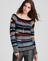 Enriched with multi-colored stripes and a classic boat neckline, our latest Free People sweater, offers a cozy layer in a soft wool blend for fall.