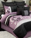 Floral chic. Give your room a new point of view with this sophisticated Isabella comforter set, boasting a sweet color scheme of pretty purple and dramatic black. Applique flowers, pin tuck pleats and embroidered details give this set lush texture for a truly stunning presentation.