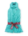 This adorable cotton mesh polo romper features a pretty belted sash at the waist and a ruffled hem.