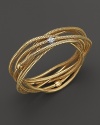 A multi-strand, shining 18K yellow gold bangle, accented with diamonds.