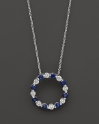 Diamond and sapphire circle pendant in 14K white gold.