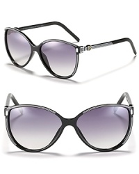 Oversized cat eye sunglasses with sporty stripes and signature logo detail a temples, a fun pair with a retro feel.