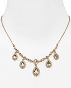 Dress up a simple look or go all out and sparkly with this gleaming drop necklace from Carolee. This piece features crystal-adorned teardrops for a notice-me neckline.