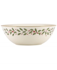 Perfect for entertaining, this large bowl is trimmed with gold and a holly motif to match the beloved Lenox Holiday dinnerware collection.