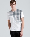 Like a water color painting, the signature check pattern fades into the slightest of abstractions on this cool, comfortable tee from Burberry Brit.