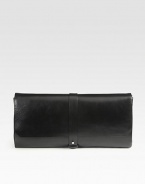 A roomy flap-top design in ultra-rich Bovine leather is timeless and sophisticated. Strap and stud flap closureSide decorative snap closuresThree inside zip pocketsOne inner mirrorSuede lining14W X 7¼H X 1DMade in Italy