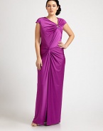 A bejeweled, floor-skimming satin gown that will turn heads this season. The gathered, twist-front bodice is especially flattering for curvy figures.Asymmetrical necklineCap sleevesJewel embellishmentGathered, twist-front bodiceConcealed back zipperAbout 46 from natural waist93% polyester/7% spandexDry cleanImported