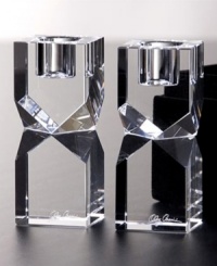 Give decor a distinctly modern edge with Lexington candle holders. Heavy crystal cut in bold geometric shapes bring acclaimed designer Oleg Cassini's keen sense of style right into your living room.