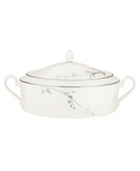 Birch branches grow around this pure white porcelain covered vegetable bowl, turning formal tables into serene landscapes. A contemporary design refined in polished platinum with a breezy, all-natural beauty. With double handles and an ornamented lid. From Noritake's collection of serveware and serving dishes.