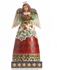 Hark! This gentle angel sets a joyful tone in holiday homes. Baby cardinals chirping in her basket and carved in her skirt celebrate the beauty of nature. With brilliant holly detail, red check and swirling winter wind. From Jim Shore.