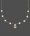 For the little girl who has stolen your heart. This illusion necklace features cultured freshwater pearls (5-6 mm) with a 14k gold dangling heart charm. Set in 14k gold. Approximate length: 13 inches. Approximate drop: 1/2 inch.