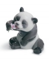 A cheerful panda trades his bamboo lunch in for a purple bloom in this irresistible Lladro collectible, handcrafted in fine porcelain.