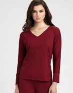 Ultra-soft stretch knit with a flattering neckline and long sleeves for the coziest evenings. V-neckLong sleevesBanded cuffsAbout 24 from shoulder to hemPolyester/rayon/spandexMachine washImported